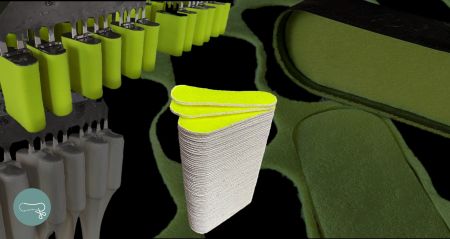 Dans le processus de fabrication des balles de tennis, les feutres soigneusement découpés sont enduits de colle blanche.